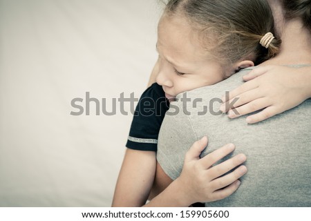 sad daughter hugging his mother