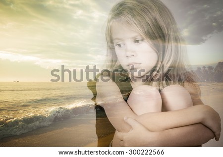 Double exposure of portrait of sad blond little girl and colorful sunset over the sea.