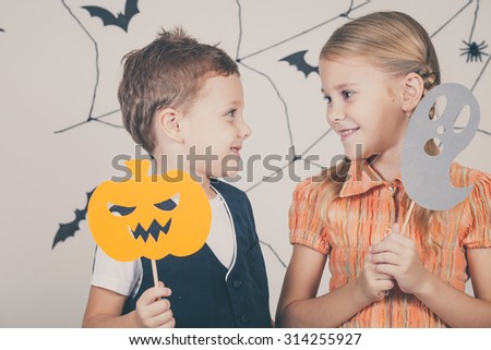 Happy brother and sister on Halloween party