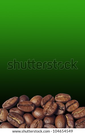 Coffee beans on against the backdrop of a green gradient