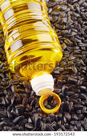 Vegetable oil in plastic bottle and sunflower seeds