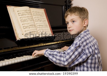 Little boy playing the piano