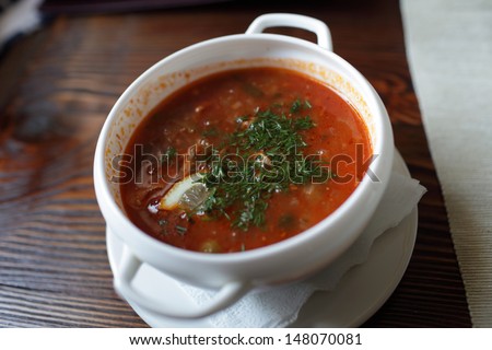 Plate of red soup in the russian restaurant