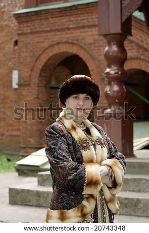 The woman in historical clothing in summer