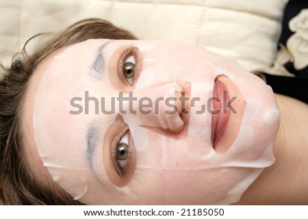 The girl with face pack, close-up