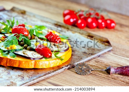 healthy vegetable pizza concept - pizza made of pumpkin and vegetables
