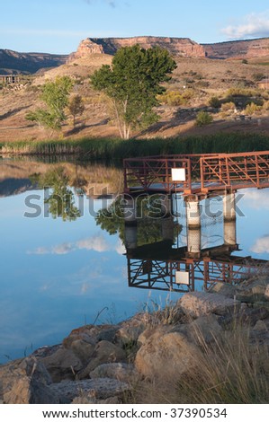 Vertical early morning shot of Shadow Lake near the Redlands Mesa neighborhood, Grand Junction, Colorado