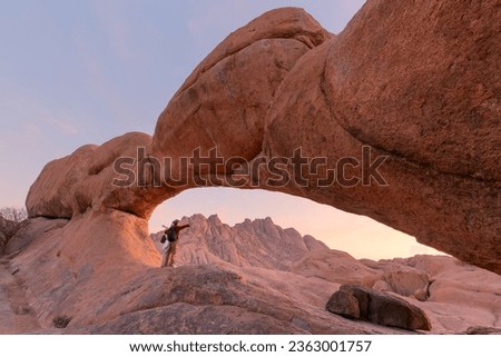 Similar – Image, Stock Photo Beautiful sunrise at Damaraland, Namibia. Group of people seen from their back walking up a mountain.