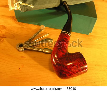 Smocking pipe set 2. A set of equipment necessary to smoke pipe. It consist from pipe, bag for the tobacco, tools for maintaining the pipe  an box in everything is keeping.