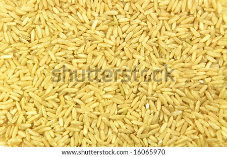 Brown rice as background. A pile of brown rice as background. Very good for prints over packing materials.