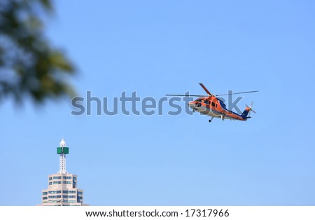 Helicopter flying in sky of Toronto. Helicopter air transportation flying in the sky of Toronto.
