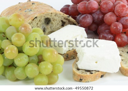 Healthy Food. Healthy Mediterranean snack food. Different types grape, Sliced Olive bread and White Greek cheese.
