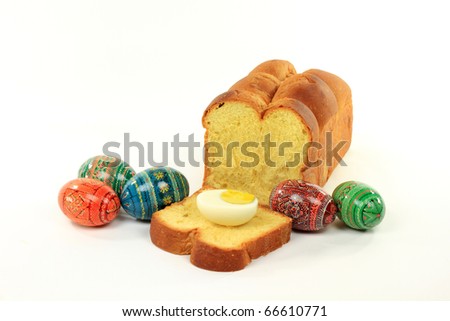 Still life picture group of Easter Colored Eggs, Half Egg, and Egg Bread on White Background.
