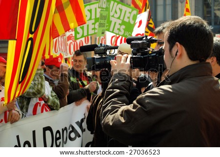 BARCELONA- MARCH 19: Television crews record during students demonstration against new education system on March 19, 2009 in Barcelona. Two dozen students injured and more than 30 officers hurt.
