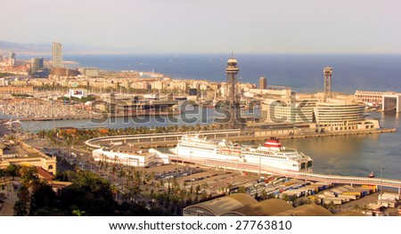panorama of evening barcelona with a kind on port and tourist entertaining complex Port Well