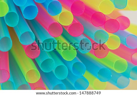 Mix of plastic colored drinking straws.