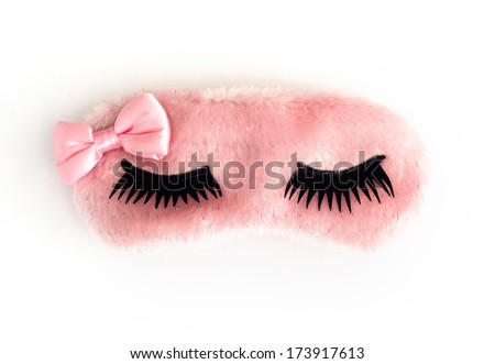 Pink sleeping mask on a white background.