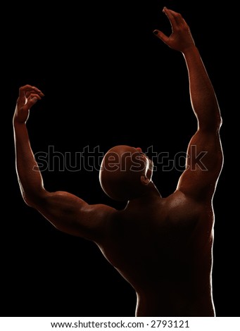 Male figure stretching. High contrast lighting