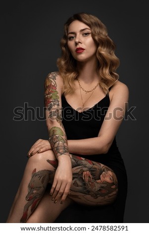 Similar – Image, Stock Photo Stylish tattooed woman on street