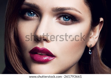 Portrait of beautiful girl with pink lips and blue eyes