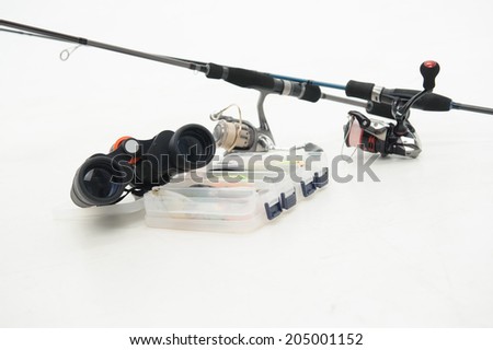 Great spinners binoculars and plastic box for flies are the necessary things for your fishing. Isolated on white background