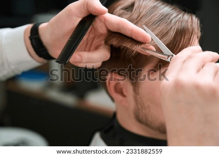 Similar – Image, Stock Photo Crop barber doing haircut for man