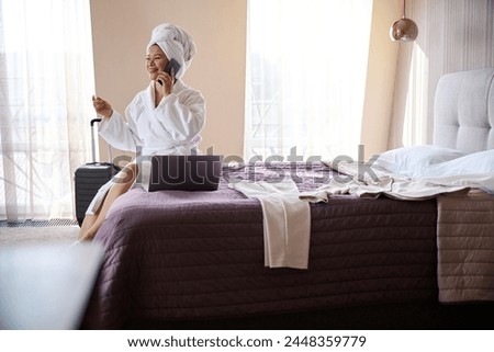 Similar – Image, Stock Photo Businesswoman having smartphone conversation near gray wall