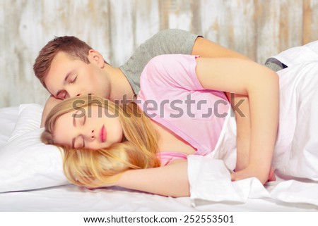 Sweet dreams. Beautiful young loving couple sleeping together in bed