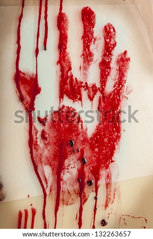 Bloody hand-print on grungy dirty background