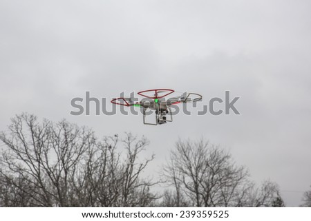 St.Louis Missouri. - DECEMBER19: Editorial photo of a DJI Phantom drone in flight with a mounted GoPro Hero3 Black Edition digital camera on December 19, 2014 in St.Louis Missouri over corn field
