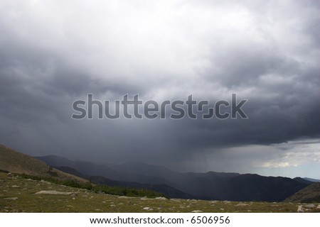 Rain and thunderclouds in the mountains tundra prairies forests of Cordeliers