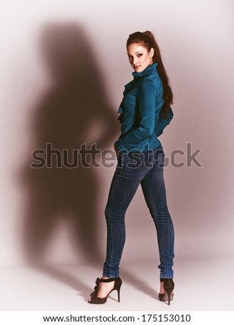 girl doing poses and shadows on light background