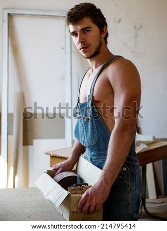 Portrait of a man in the room where the carpenter to make repairs