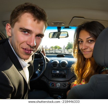 Portrait of a couple of young people in the car