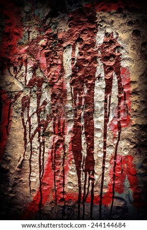 spilled red and brown paint on the wall