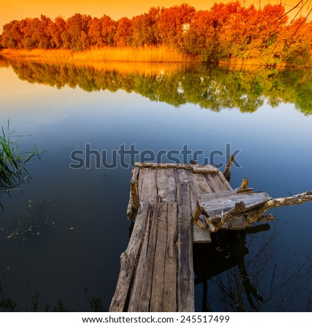 rural landscape, the river and the old wooden bridge, spring season