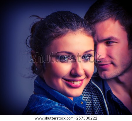 cute young couple man and woman portrait in studio