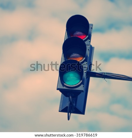 blurred background, the old traffic light on the background of sky