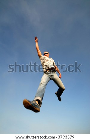 young guy in  jump on  background  dark blue sky