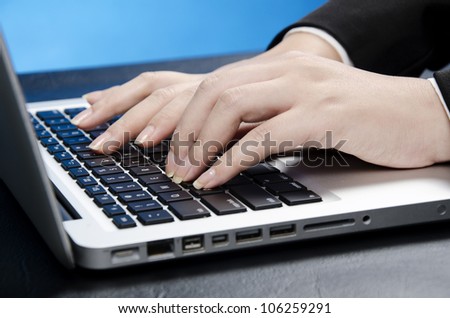 female fingers on computer keyboard