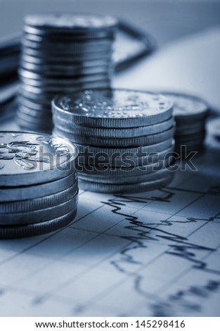 Photo of singapore coins and business chart