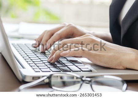 woman typing document in an office