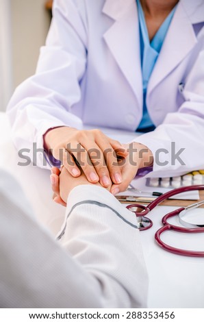 portrait of doctor consulting and cheering patient