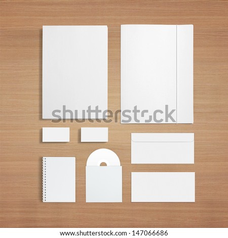 Blank Stationery Template on wooden background. Consist of Business cards, letterhead a4, envelopes, CD Disk, note.