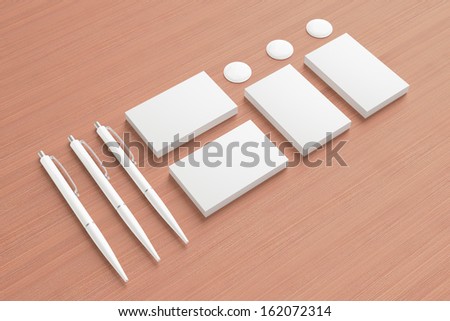 Blank Stationery Corporate ID set on wooden background. Consist of Business cards and pens.