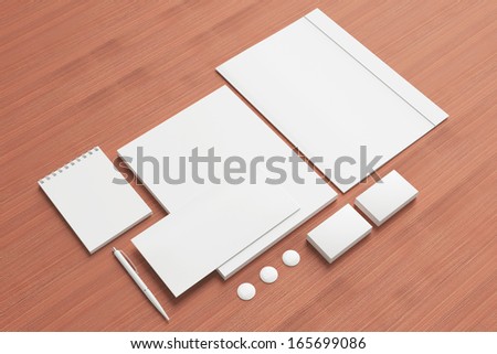 Blank Stationery / Corporate ID Set on wooden background. Consist of Business cards, Folder, envelopes, a4 letterheads, pens,folder.