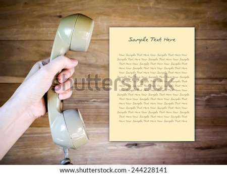 women hand holding Telephone Receiver with note paper