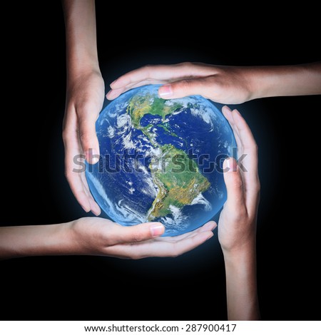 Four hands save the world  on black background ,Elements of this image furnished by NASA