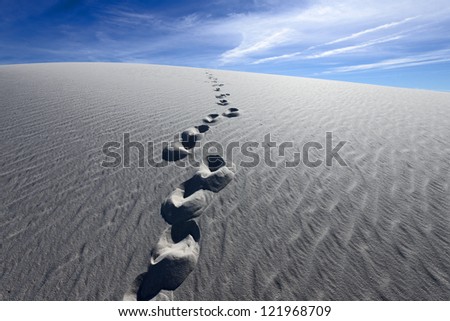 Footprints on Alkali Flat Trail in White Sands National Monument, New Mexico, USA.