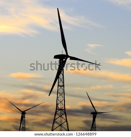 Silhouette of a wind turbine during sunset.  Palm Springs, California.